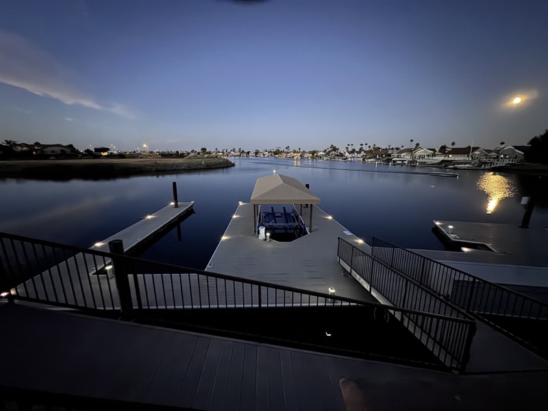 Discovery Bay dock at dusk with custom lighting by ZanderPink Design